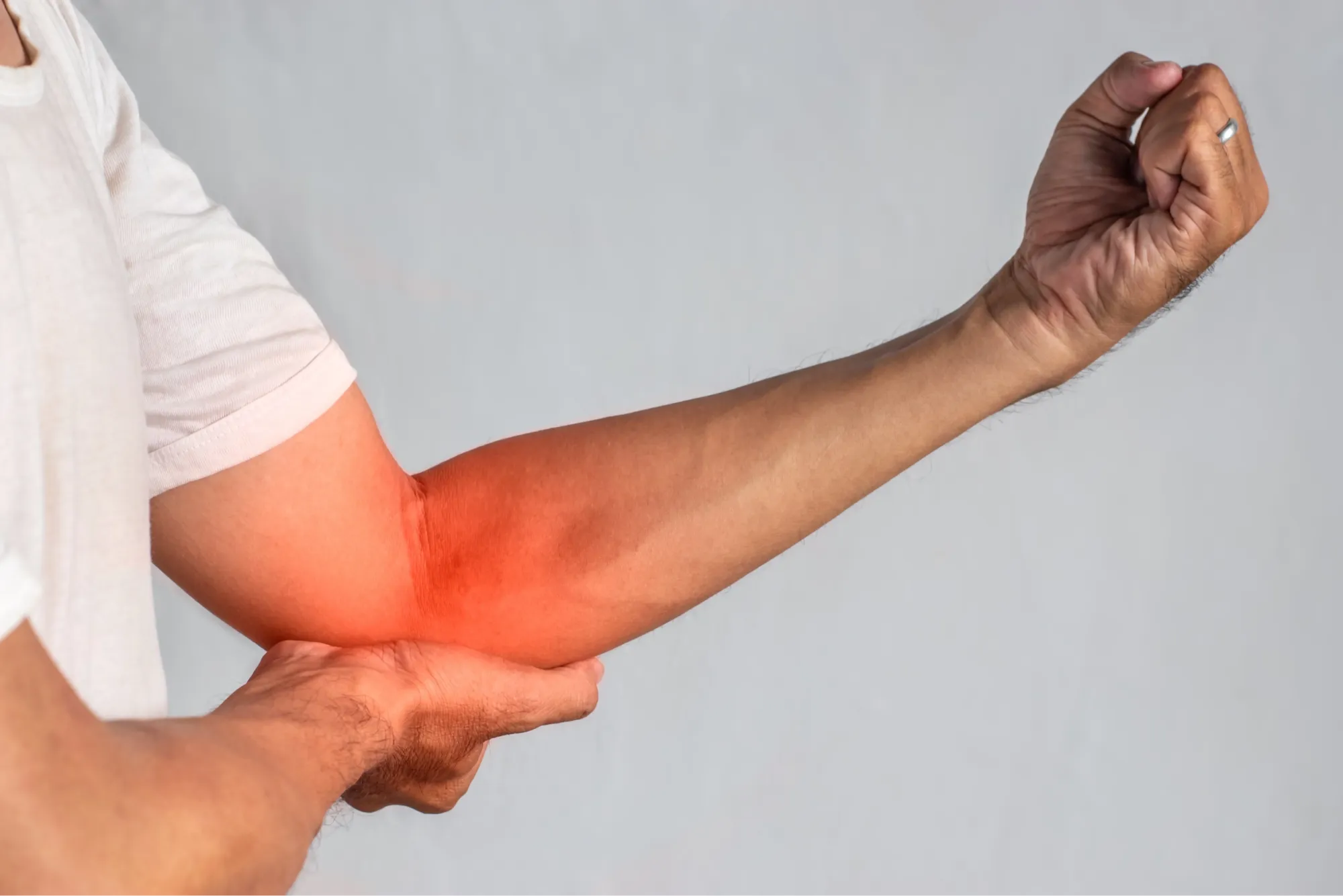 Patient experiencing elbow arthritis symptoms